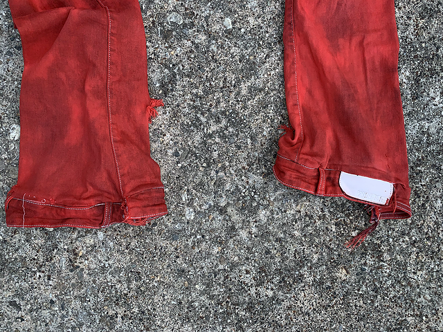 “DYED RED JEANS”