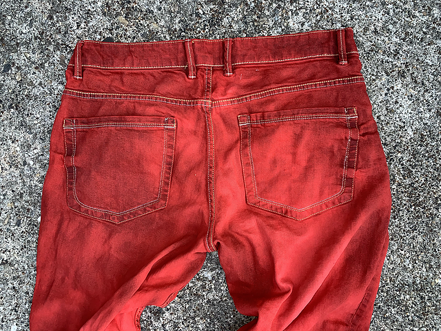 “DYED RED JEANS”